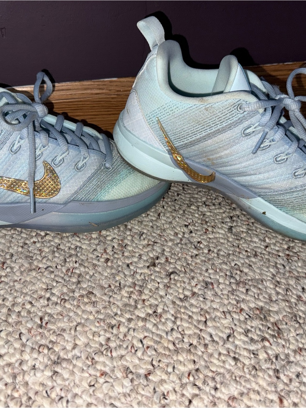 Nike Women's Light Blue Athletic Sneakers with Gold Swoosh Accents